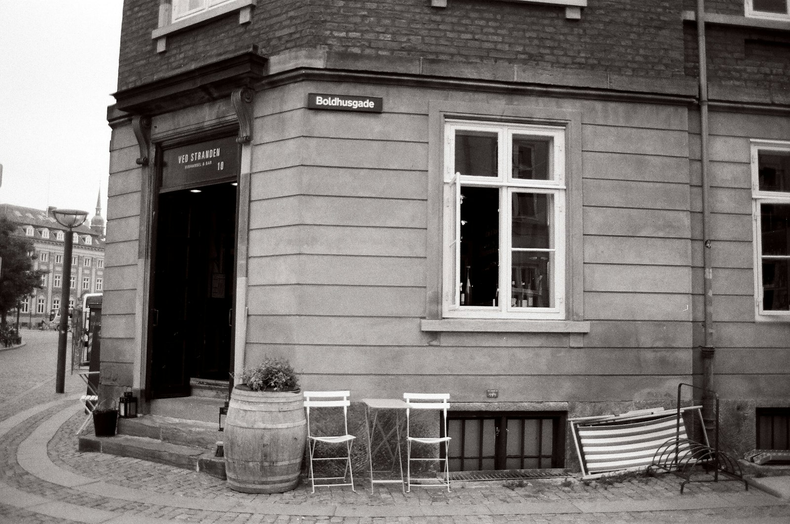 white and red wooden chair near brown wooden door